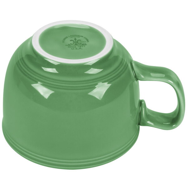 A green Fiesta china cup with a white rim.