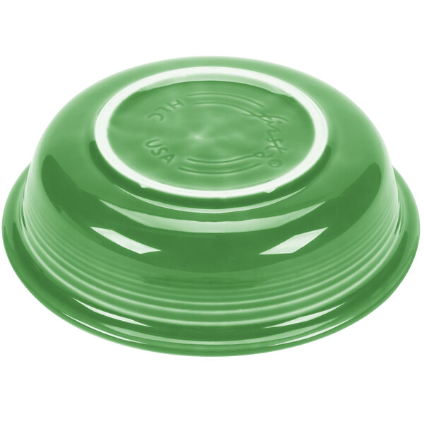 A green Fiesta china bowl with a white rim.