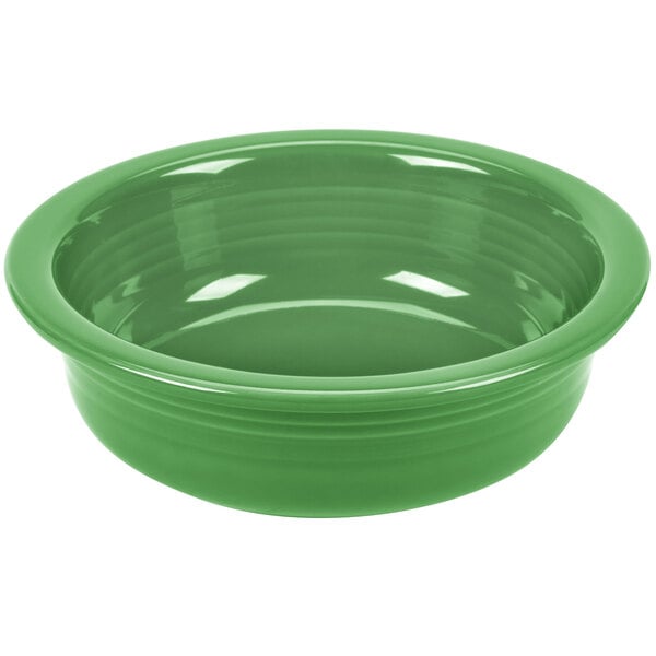 A green Fiesta serving bowl on a white background.