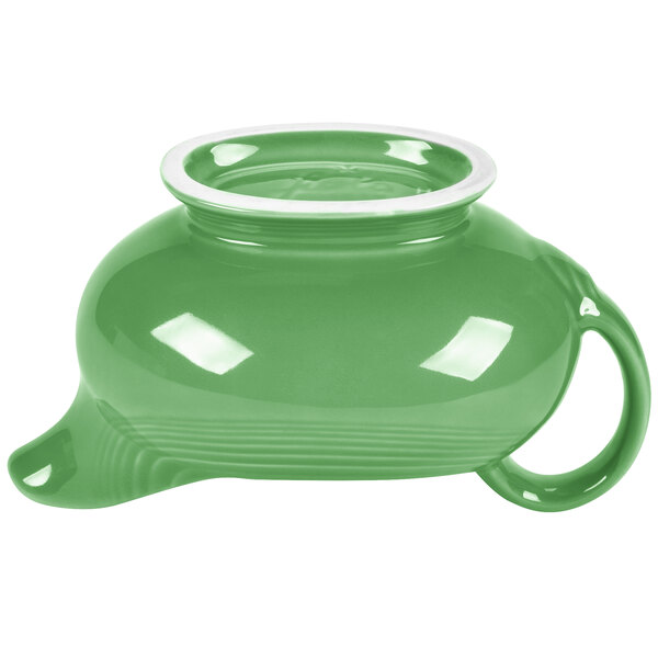 A green Fiesta gravy boat with a white rim.