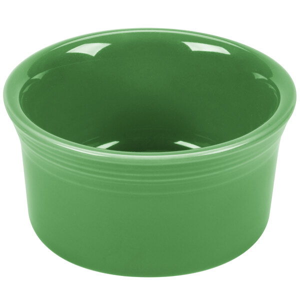 A green Fiesta ramekin with a white interior.