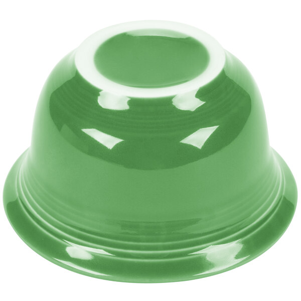 A close-up of a green Fiesta® bouillon bowl with a white rim.