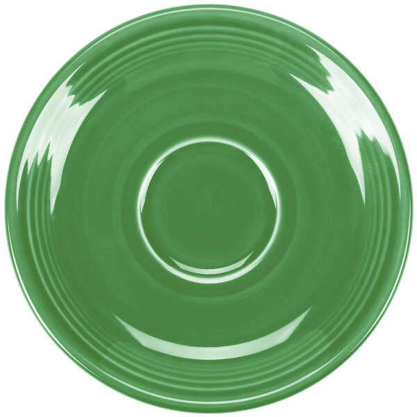 A green Fiesta saucer with a circular ring on the rim.