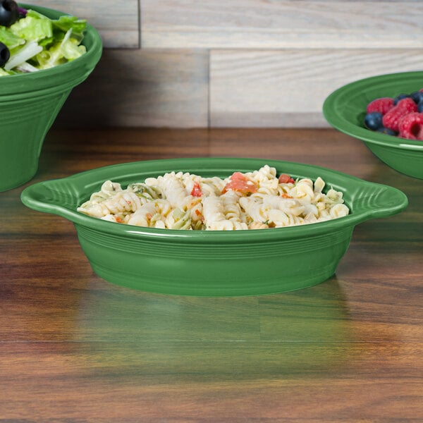 A Fiesta oval china baker filled with pasta and salad.