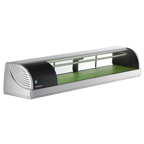 A Hoshizaki refrigerated sushi display case with a curved glass top on a stainless steel counter.