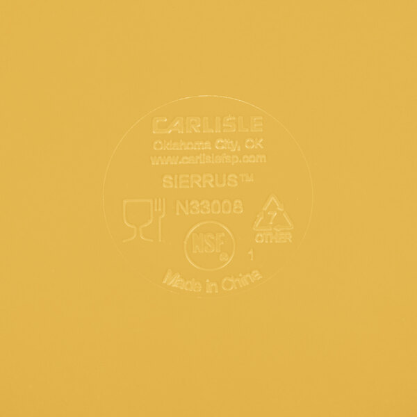 A yellow Carlisle label on a yellow surface.