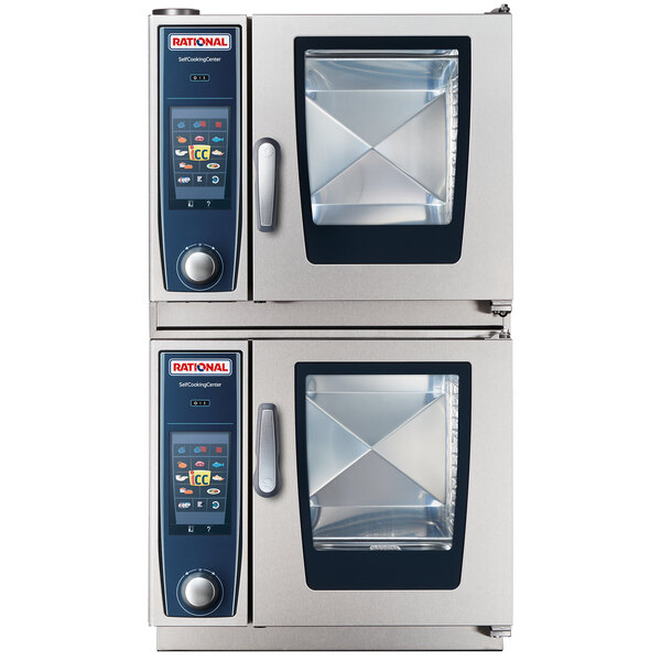 A close-up of two large silver and blue Rational Duo XS combi ovens stacked on top of each other.