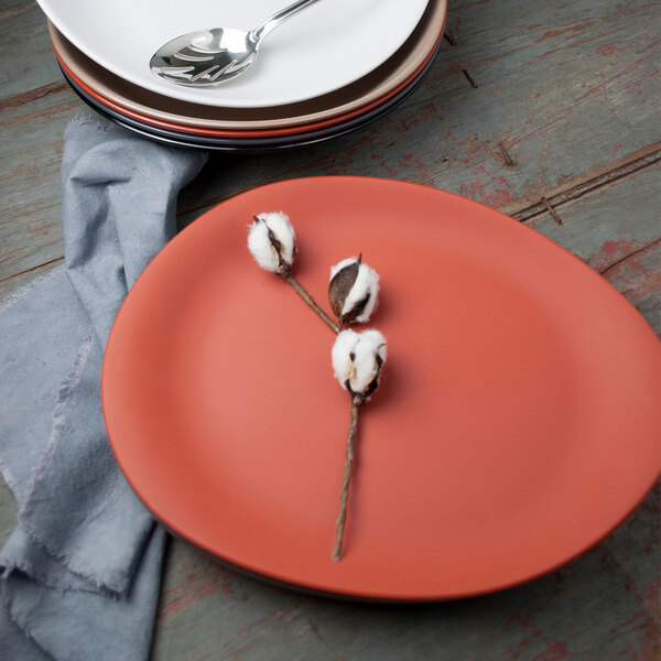 A Libbey Driftstone melamine platter with a spoon on it.