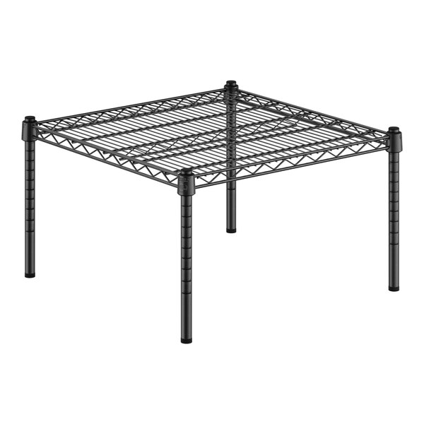 A black wire shelf with legs.