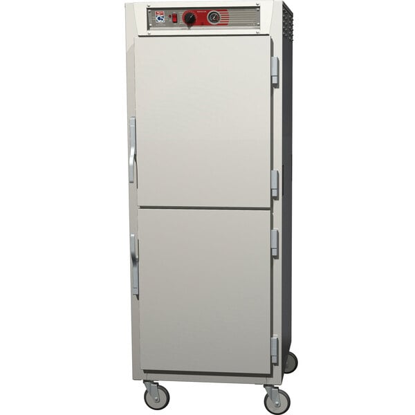 A stainless steel Metro C5 holding cabinet with wheels.