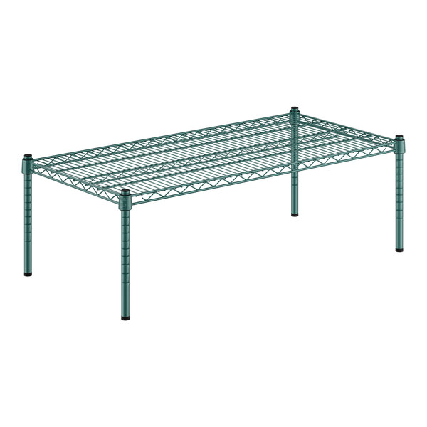 A green wire shelf with black posts.