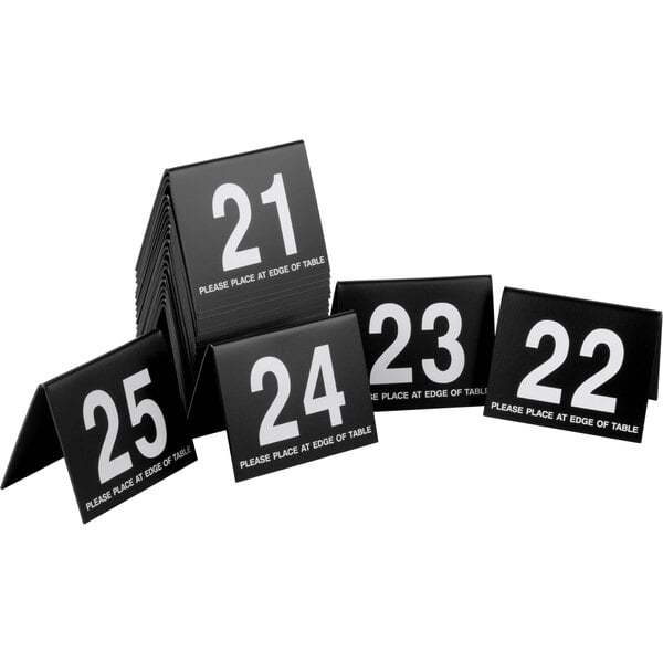 a black and white sign with white numbers