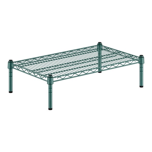 A green wire shelf with black legs.