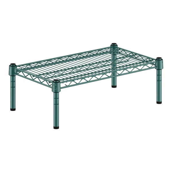 A green metal Regency wire shelf with black legs.