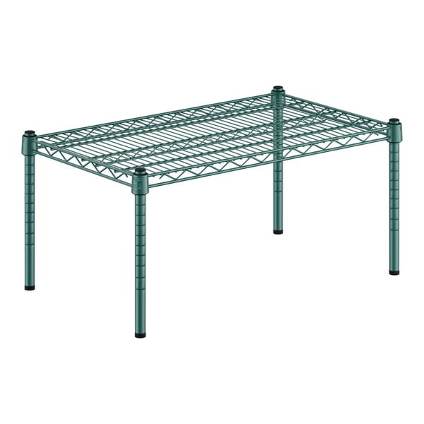 A green wire shelf with black legs.