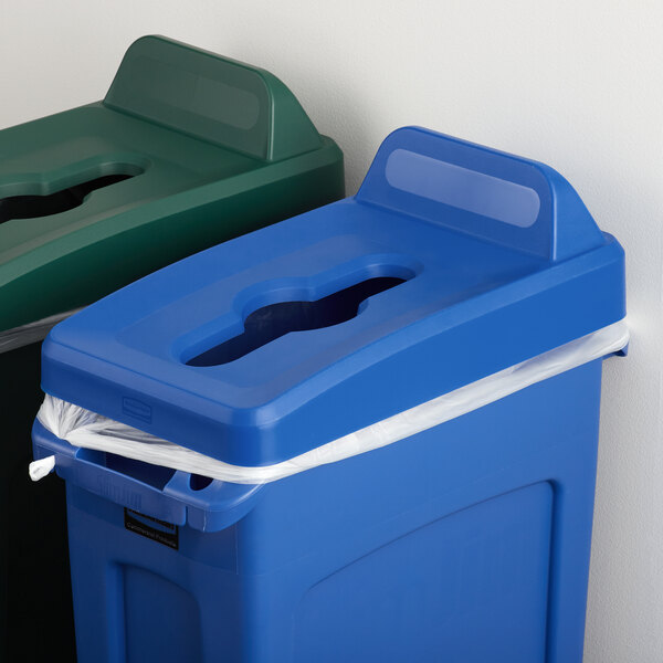 A blue Rubbermaid Slim Jim recycling bin lid with a hole in the top.