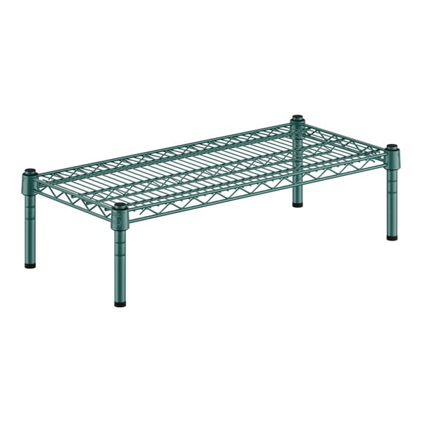 A green metal Regency wire shelf with black legs.