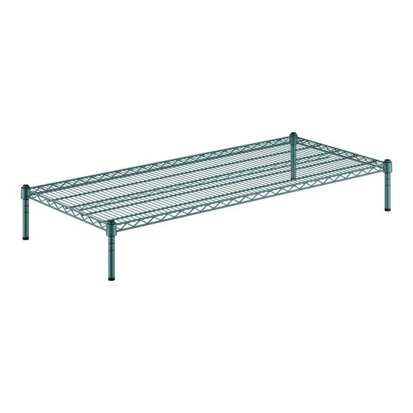 A green wire shelf with black legs.