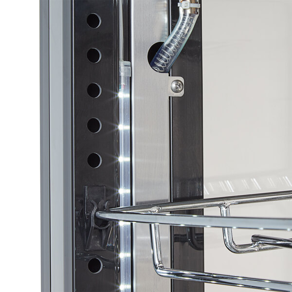 A metal shelf with a tube used to display wine bottles.