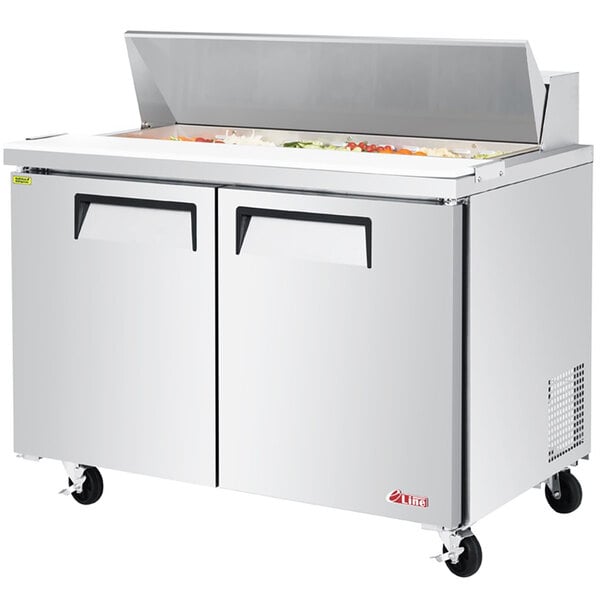 A Turbo Air stainless steel refrigerated sandwich prep table with two doors.