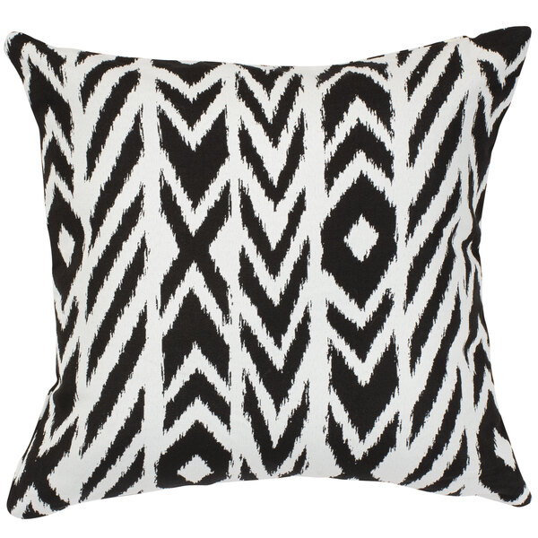 A black and white geometric throw pillow with a charcoal background.