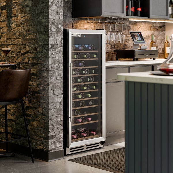 A single temperature full glass door commercial wine cooler filled with wine bottles.