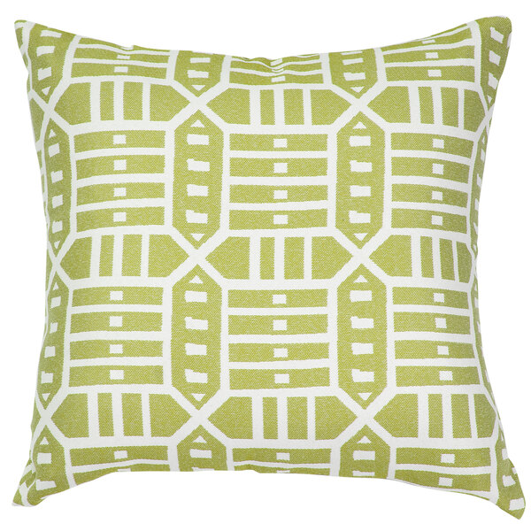 A green and white throw pillow with geometric patterns.