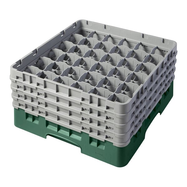 A large green plastic container with several empty gray trays inside.