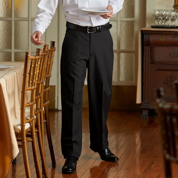 A person wearing Henry Segal black dress pants.