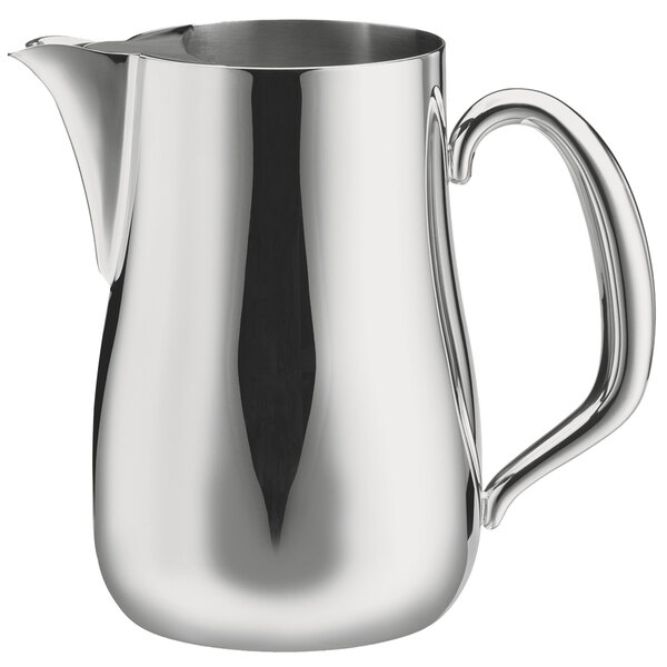 A Walco brushed stainless steel pitcher with a handle.