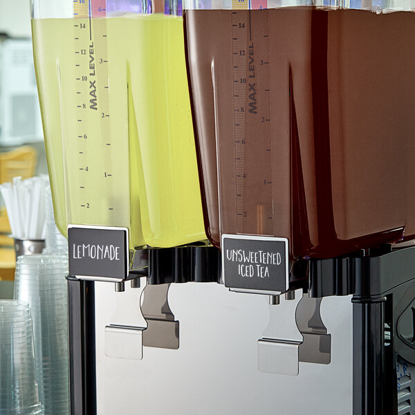 A group of Narvon iced tea concentrate dispensers on a table.