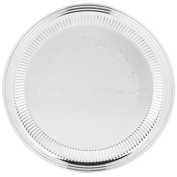 A silver tray with a design on it.