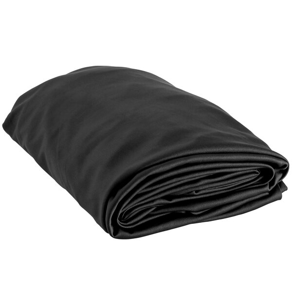 A black folded Snap Drape spandex table cover on a white background.