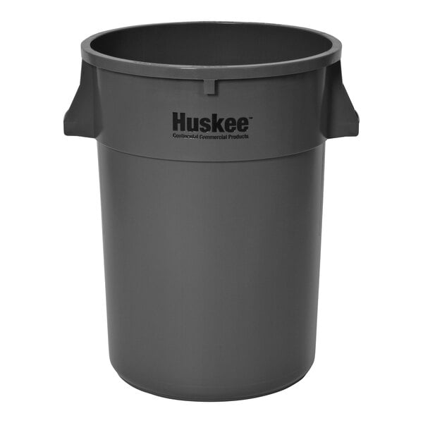 A gray plastic Continental Huskee trash can.