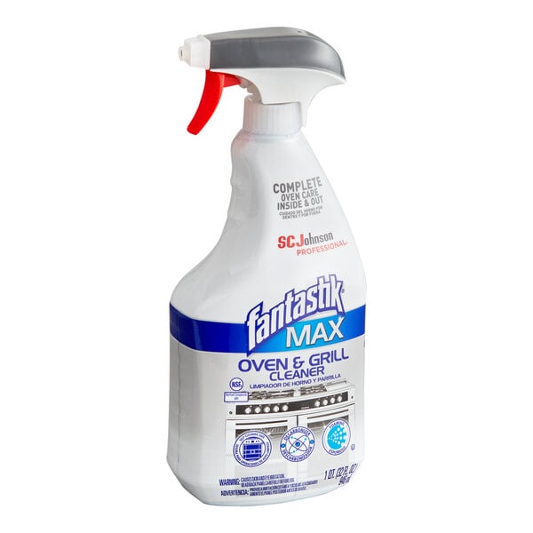 A white spray bottle labeled 'fantastik MAX Oven & Grill Cleaner' with a red and gray trigger nozzle.