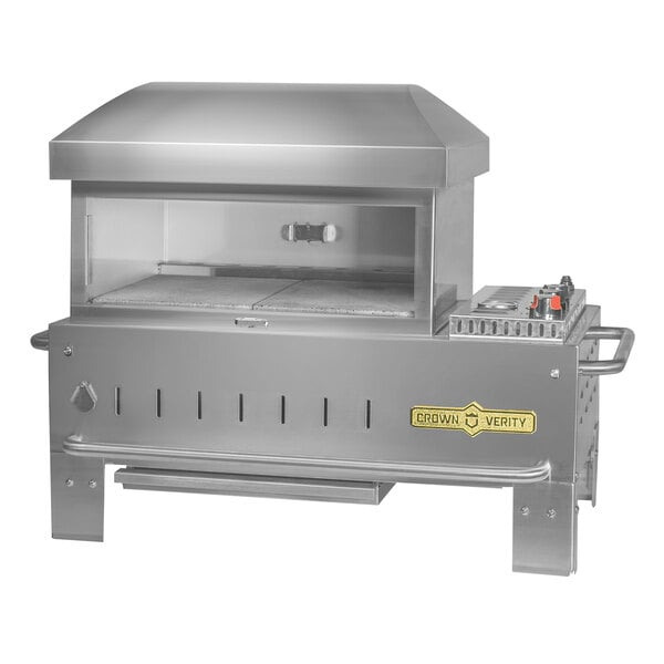 A stainless steel Crown Verity table top outdoor pizza oven with a lid.