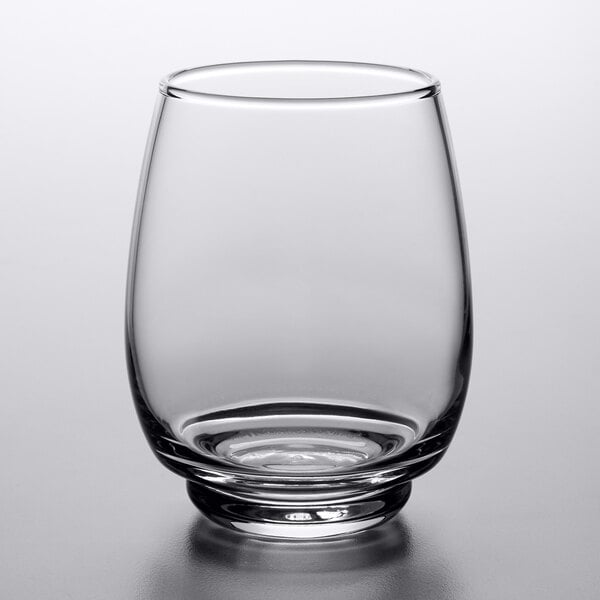 A close up of a Libbey stackable beverage glass with a round bottom.