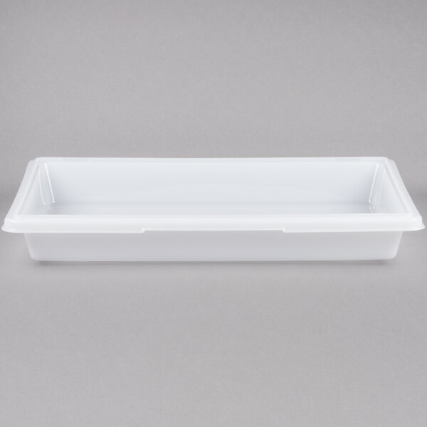 A Rubbermaid white polyethylene food storage box with a lid on a gray surface.