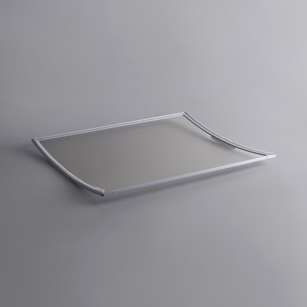 A silver rectangular metal lid with a handle.