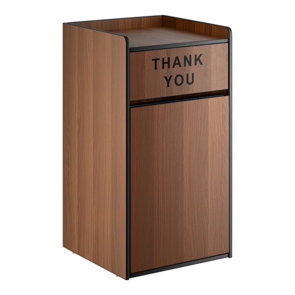 A walnut-colored 35-gallon waste receptacle enclosure with a swing door labeled 'THANK YOU'.