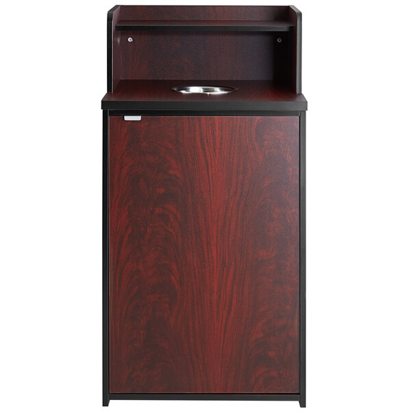 A mahogany wooden cabinet with a black top and door.