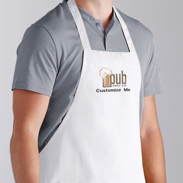 A man wearing a white Choice bib apron with the word "Cobb" on it.
