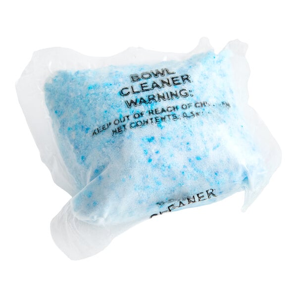 A sealed plastic packet containing blue and white concentrated toilet bowl cleaner powder.