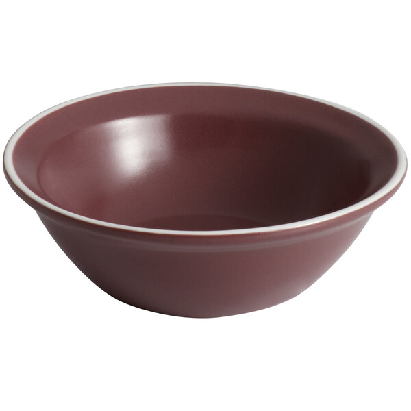 A matte mulberry bowl with a white rim.