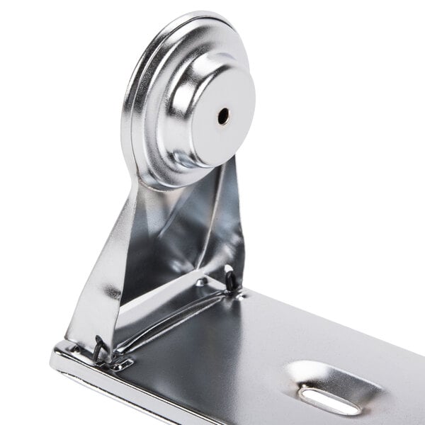 A silver metal San Jamar roll towel dispenser with a metal latch.