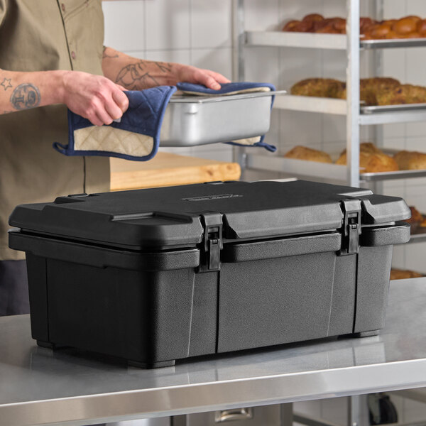 A black top-loading insulated food pan carrier designed to hold a 6-inch deep full-size pan.