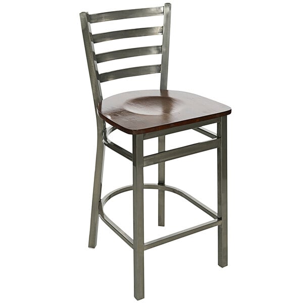 A BFM Seating metal bar stool with a walnut wooden seat.