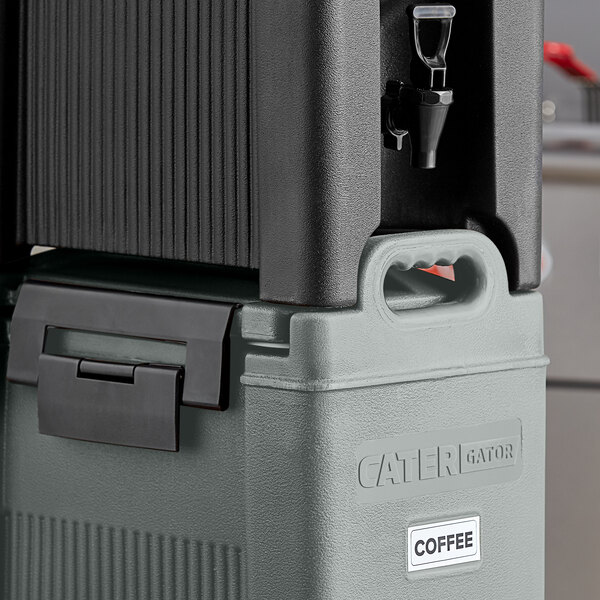 A CaterGator slate blue and black insulated beverage dispenser on a counter.