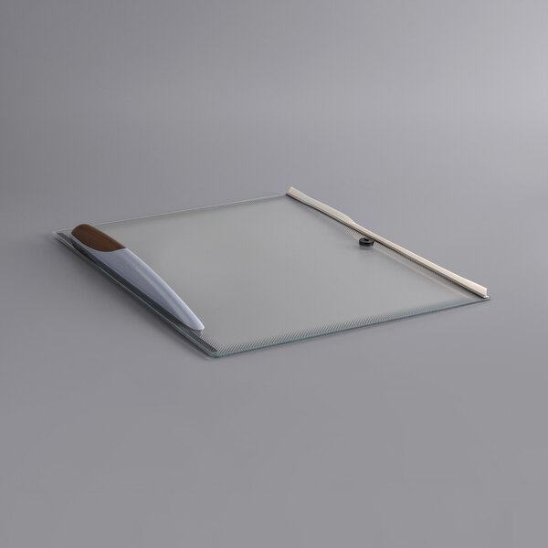 An Avantco sliding glass bottom lid on a table.