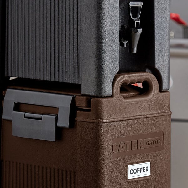 A brown CaterGator insulated beverage dispenser on a counter.